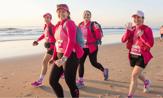 Coastrek Sunshine Coast Walk 2024 team walking on beach